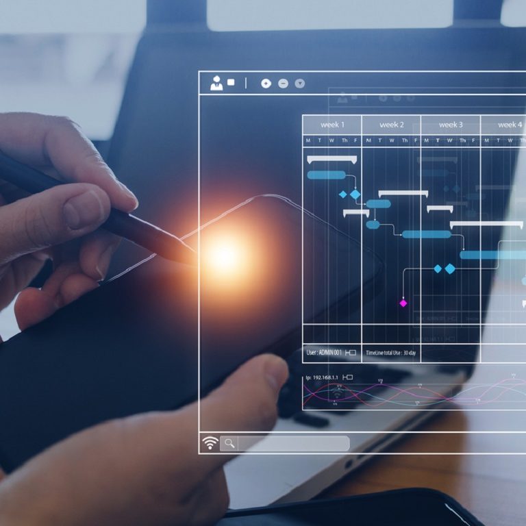 Analyst working with computer in Business Analytics and Data Management System to make report with KPI and metrics connected to database. Corporate strategy for finance, operations, sales, marketing